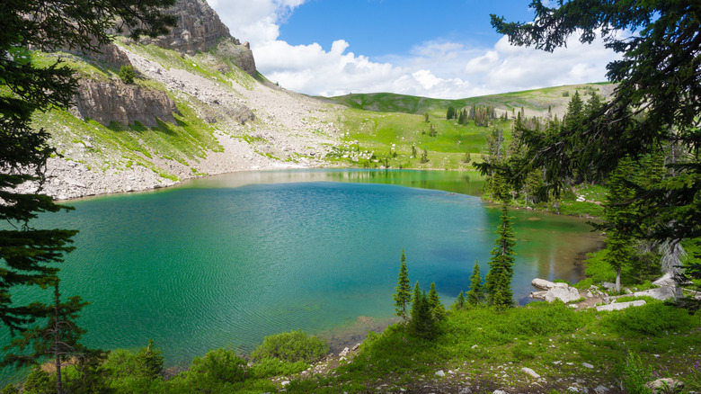 Brilliant blue alpine lake in Teton Crest Trail