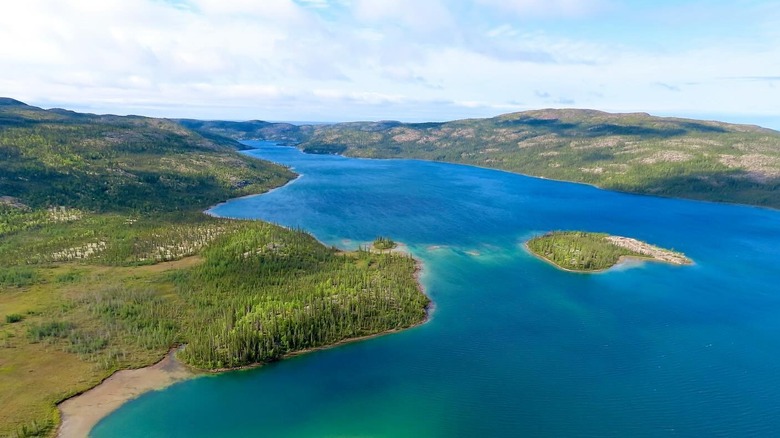 Aerial view of a large lake with bright turquoise water