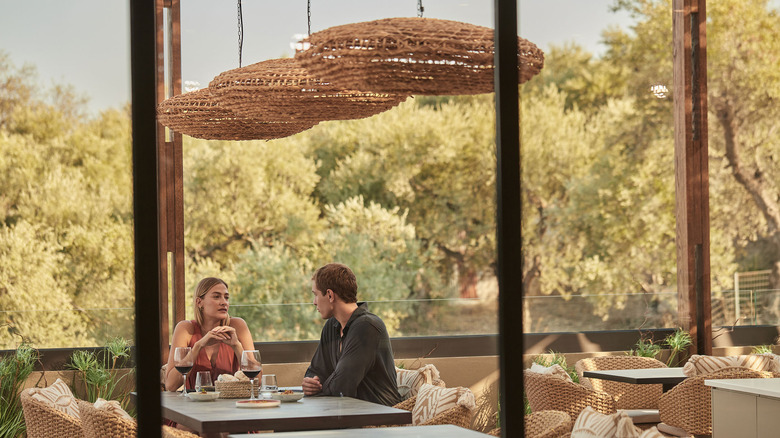 Couple enjoying a meal at a restaurant in King Jason Zante