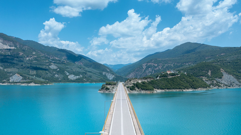 An aerial view of Episkopi Bridge above Lake Kremasta, surrounded by the Agrafa Mountains in Central Greece