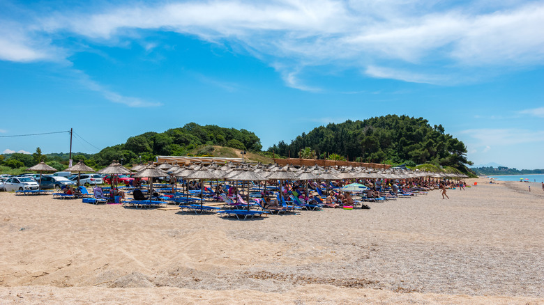 Sunbeds and umbrellas on a section of Monolithi Beach, Greece