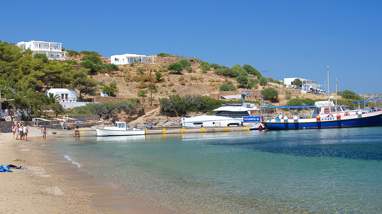 Beach and docked boats at Marathi island in Greece