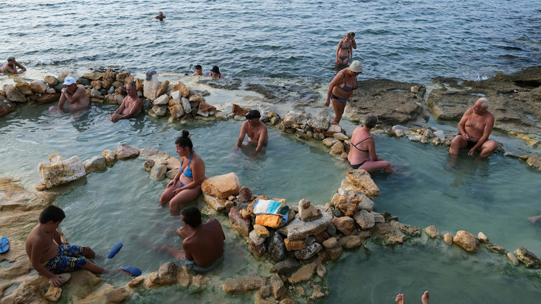 People bathing in the healing waters of Edipsos