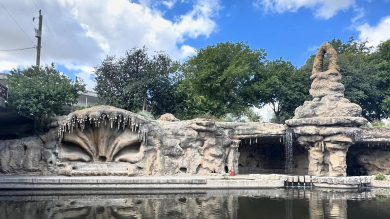 The Grotto on the San Antonio River Walk with blue sky and clouds overhead