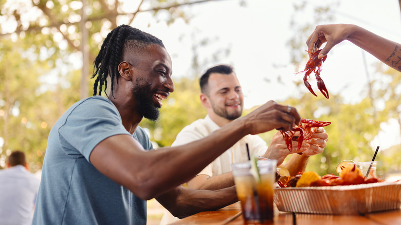 Group of friends eating crawfish