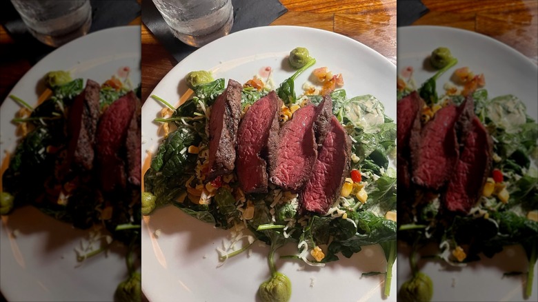 Plate of steak and greens at Jesse's on the Bay