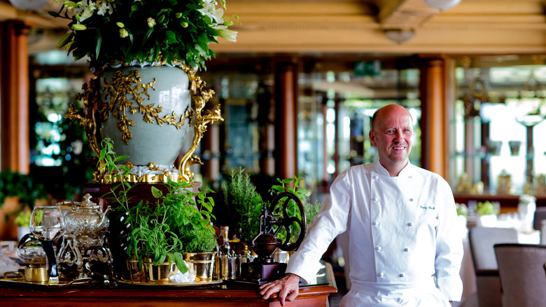 Michelin 3-star chef Heinz Beck poses in the dining room of La Pergola restaurant in Rome, Italy