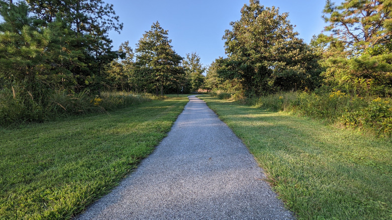 A well-kept gravel trail runs through the grass at Nottingham County Park in Pennsylvania