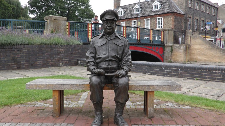 A statue of Captain Mainwaring of Dad's Army sitting on a bench