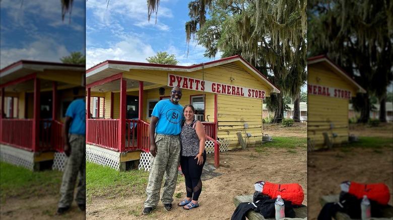 Captain Rommy Pyatt and a tour guest at the Pyatt General Store on Sandy Island