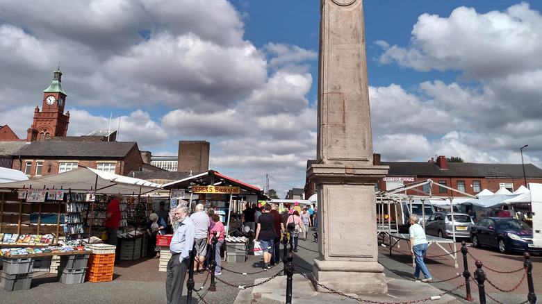Customers shop at the Earlestown Market during the Saturday car boot on a cloudy day
