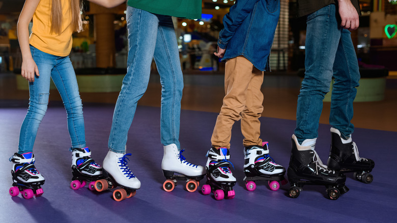People roller skating in a roller rink