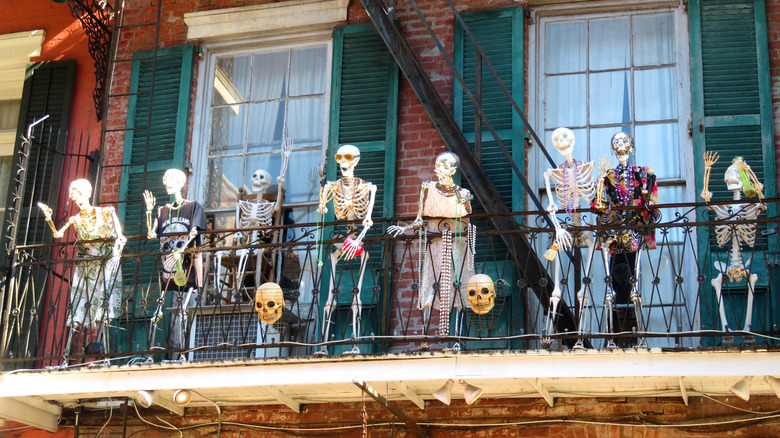 Skeleton Halloween decorations on a balcony in New Orleans