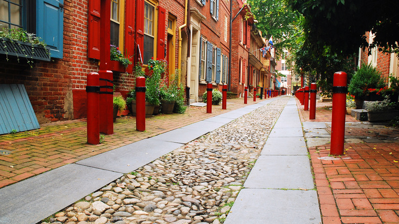A close-up of the paving stones reaches toward a vanishing point in Elfreth's Alley in Philadelphia.