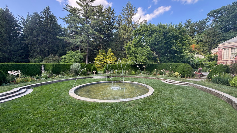 A fountain in the gardens of Newfields, Indianapolis on a sunny day