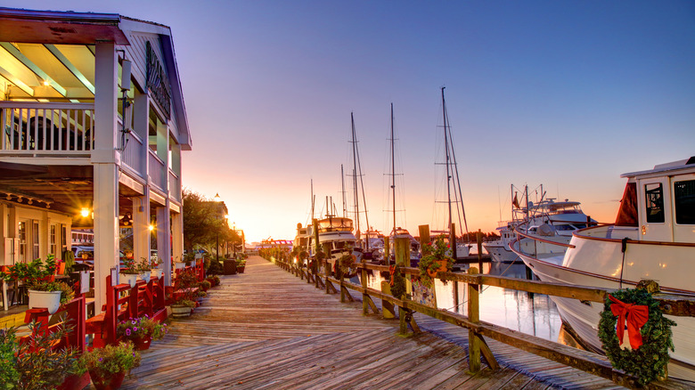 Boardwalk with boats at sunset in Beaufort, North Carolina