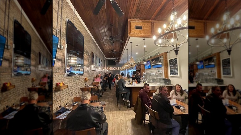 Interior of Shuck's Tavern & Oyster Bar with diners sitting at tables