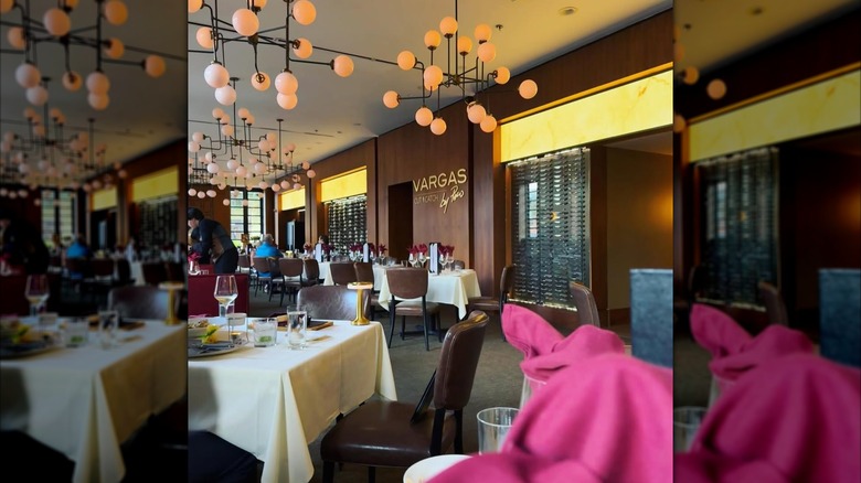 A close up of a lobster tail resting on a ribeye steak