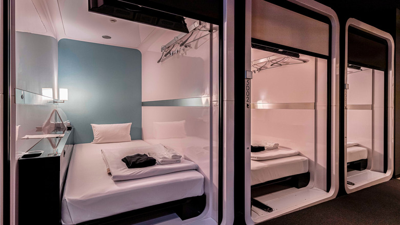 Three extra large capsules at a First Cabin hotel in Japan are extra wide and tall enough to stand in