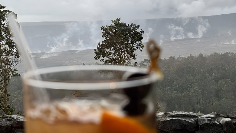 Cocktail with a view of the steaming volcanic crater at The Rim at Volcano House, Hawaii