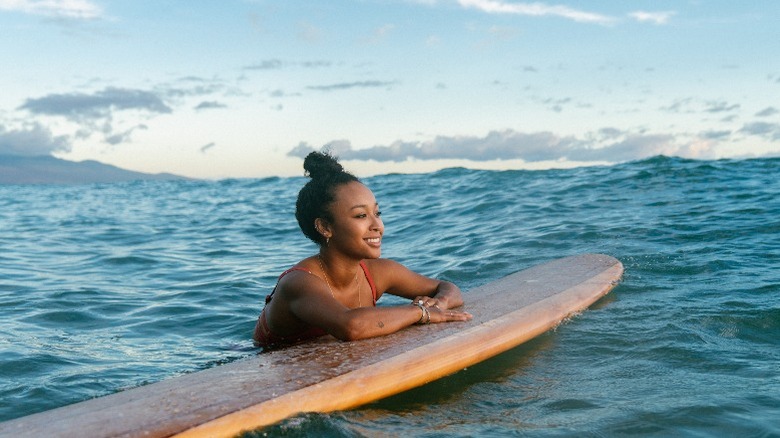 woman surfing in hawaii