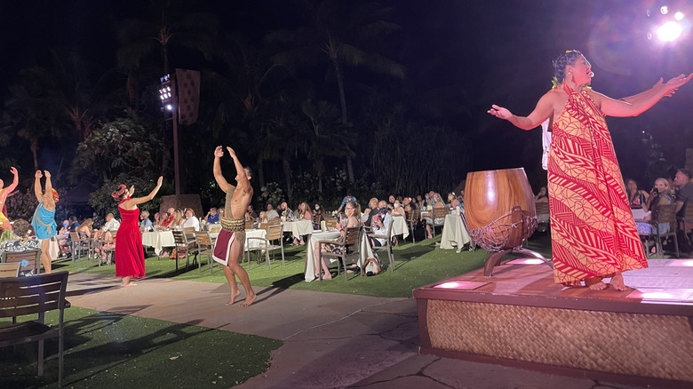 Performers engaging in storytelling during the luau at Aulani, a Disney Resort and Spa in Hawaii
