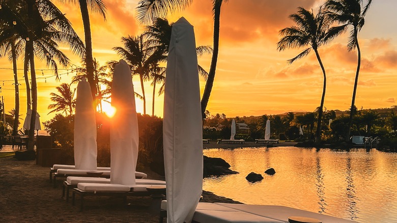Sunset over a pool at the Lodge at Kukui'ula in Kauai