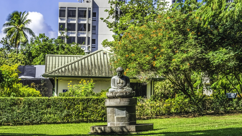 The Great Buddha statue at Foster Botanical Gardens Honolulu Hawaii