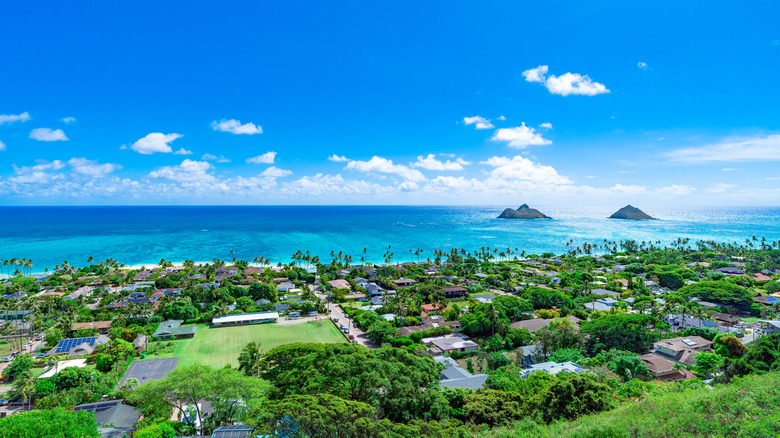 Aerial landscape of green land, buildings, and shoreline in Kailua, Hawaii