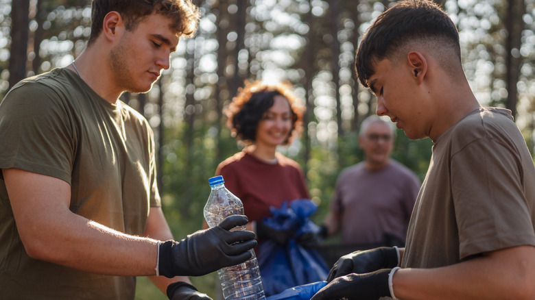 volunteers collecting trash on the trail