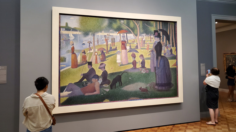Visitors view a painting in The Art Institute of Chicago