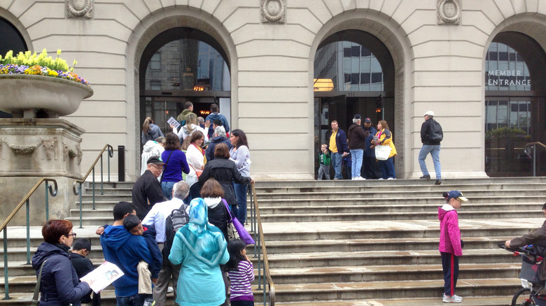 People queue in line outside The Art Institute of Chicago