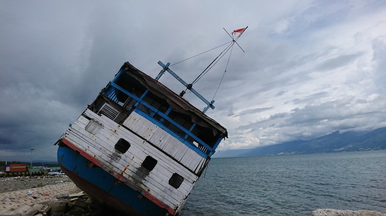 A dislodged ship in the aftermath of a tsunami
