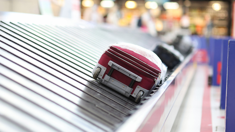 Suitcases going around the luggage carousel in baggage claim