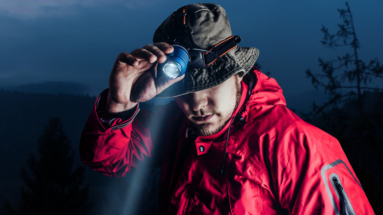 Man with camping headlamp
