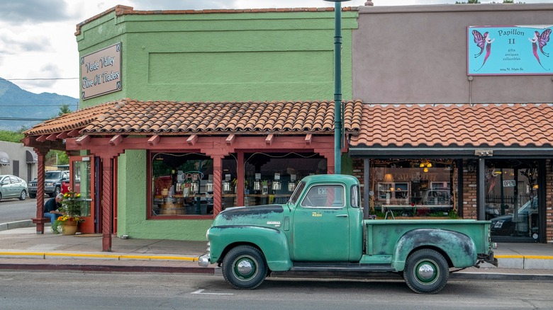 Old truck parked on colorful street in Cottonwood