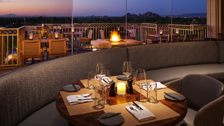 View of table at J&G steakhouse overlooking the desert