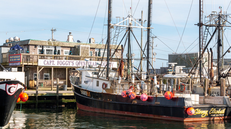 Commercial fishing lobster boats docked in port Galilee in front of Captain Foggy's restaurant and market.