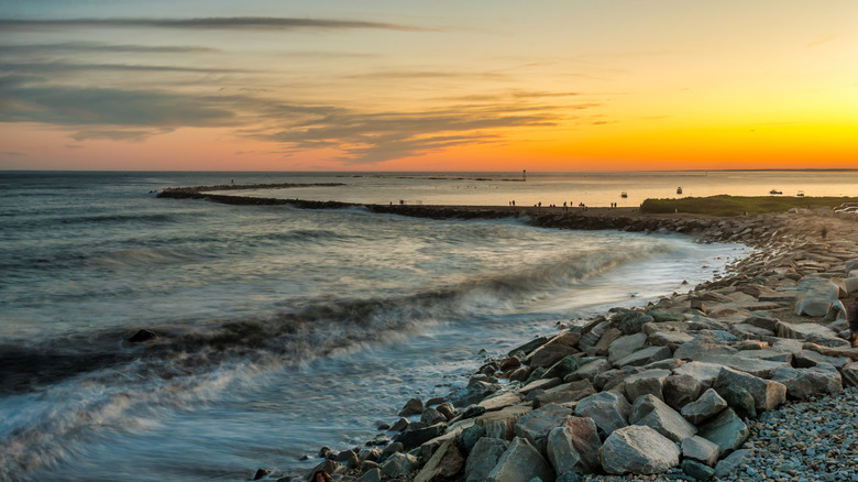 Break wall, east gap to harbor of Galilee, Narragansett, RI at sunset.