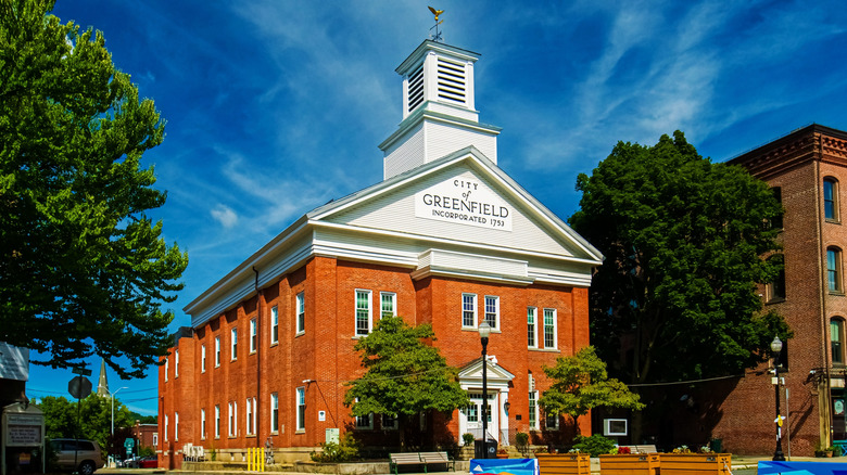 A brick building with a sign reading City of Greenfield