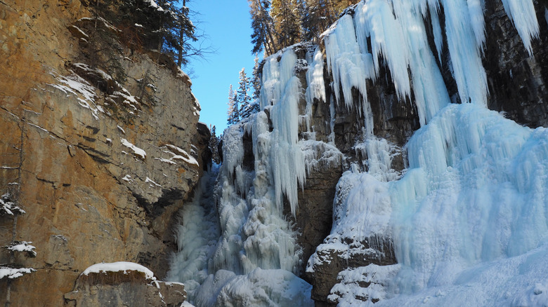 Frozen waterfall and ice formations at Upper Falls in Johnston Canyon
