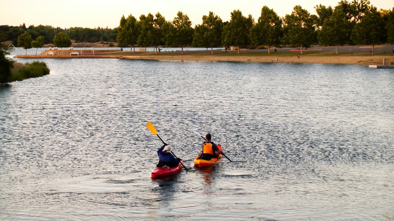 Two people kayaking on the lake
