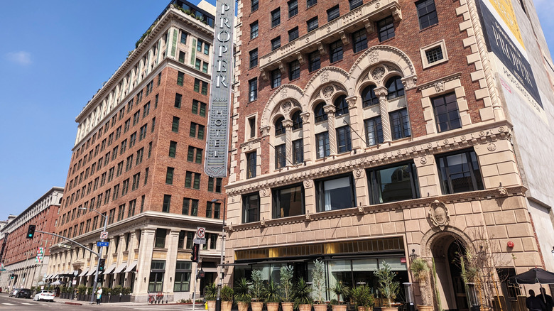 The stone facade of the Downtown L.A. Proper Hotel in daytime