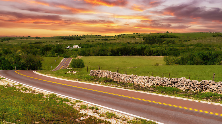 A prairie road at sunset