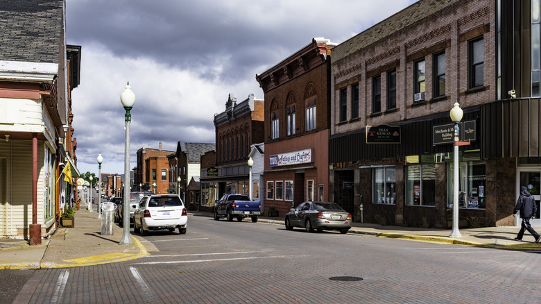 Buildings and cars lining street in downtown Calumet, Michigan