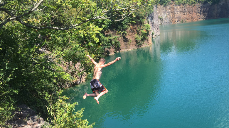 Man jumping into a quarry