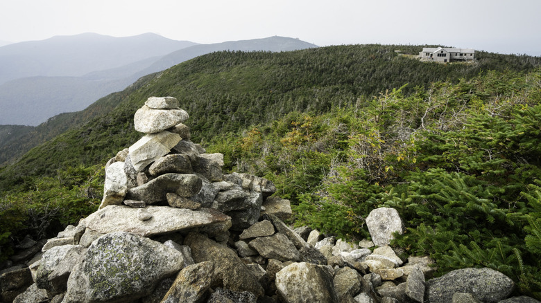 Greenleaf Hut on Mount Lafayette with stacks of rocks in the foreground