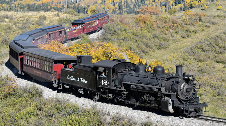 The Cumbres & Toltec Scenic Railroad train runs through the Rockies in Chama, New Mexico
