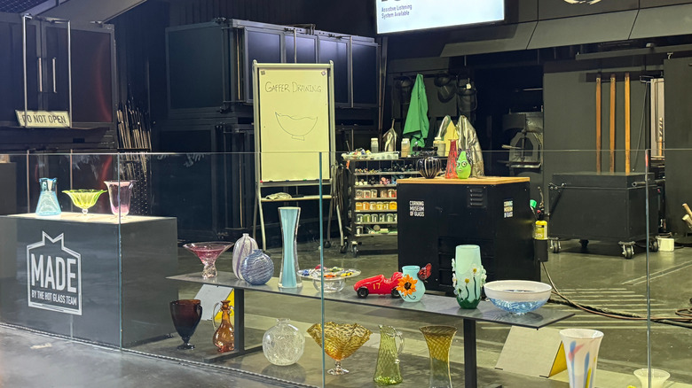 A display of glass objects in the Corning Museum of Glass demonstration area