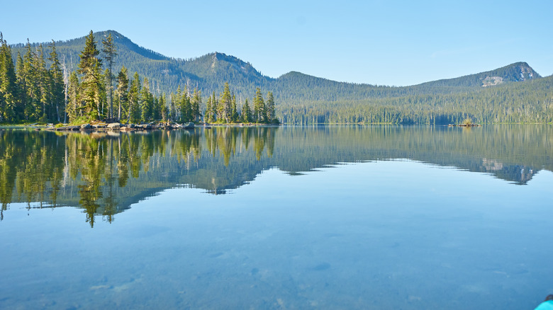The still surface of Lake Waldo high in the Oregon Cascades